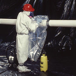 worker using 2260 asbestos glove bag 