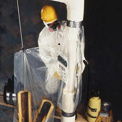worker using v10 asbestos glove bag on vertical pipe