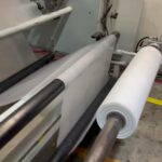 white plastic film on slitter machine