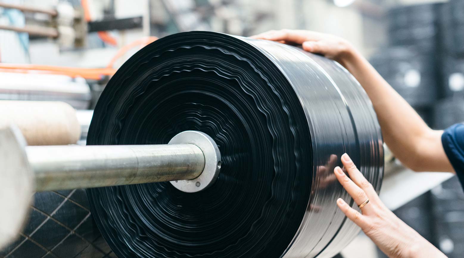 roll of black plastic film on machine