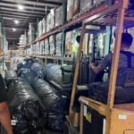 forklift moving a pallet of material in warehouse